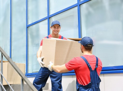 Commercial movers handling retail stock during a Stockwell relocation