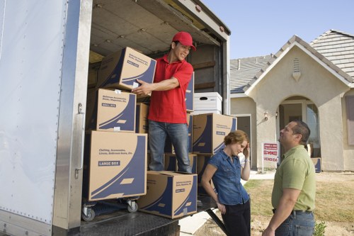 Local movers transporting furniture through Stockwell streets