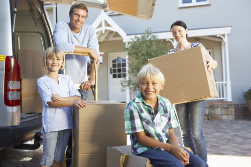 Local moving team handling packing in a Stockwell flat