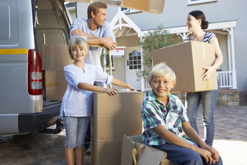 Donation boxes and reusable furniture prepared for charity partnerships during a move