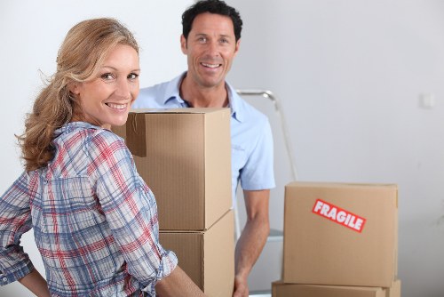 Worker carrying out careful manual handling during loading