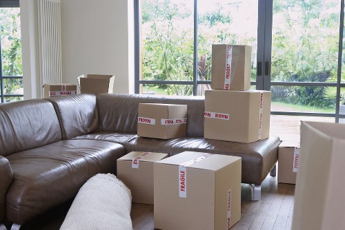 Loading furniture into a van for transport in Stockwell