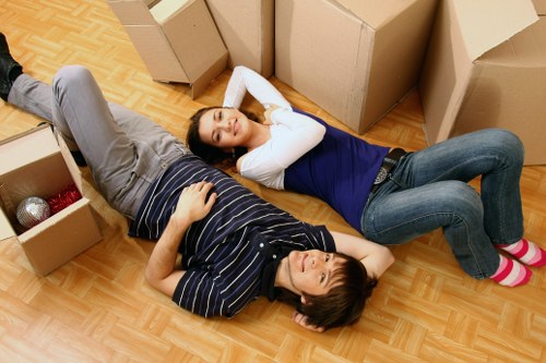 Professional movers handling stairs in a Stockwell flat removal